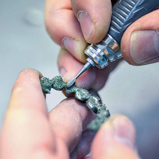 Manual laser melting bridge finishing